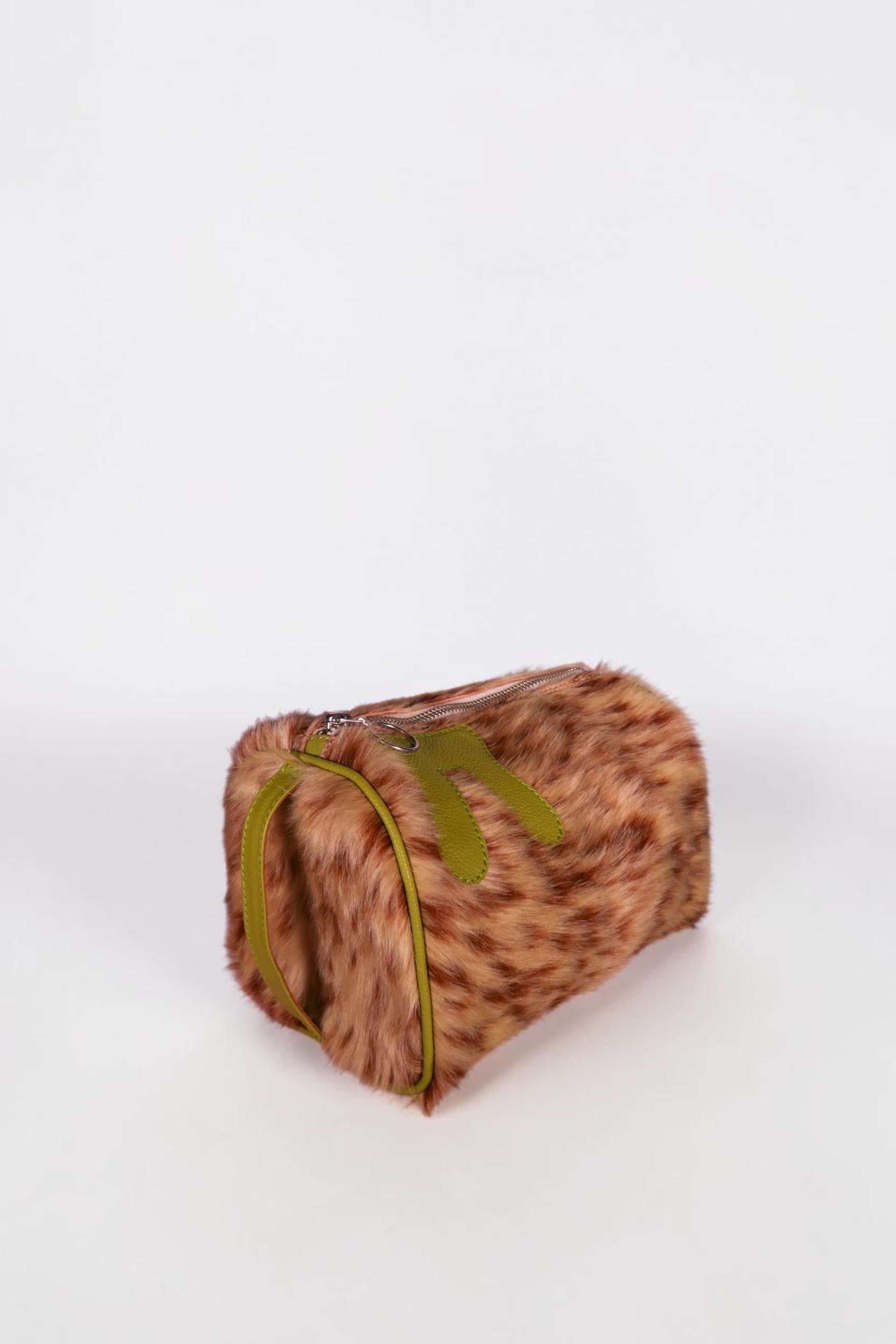 design Girls World brown and tan spotted faux fur cosmetic case with lime green leather trim and bunny ear details.