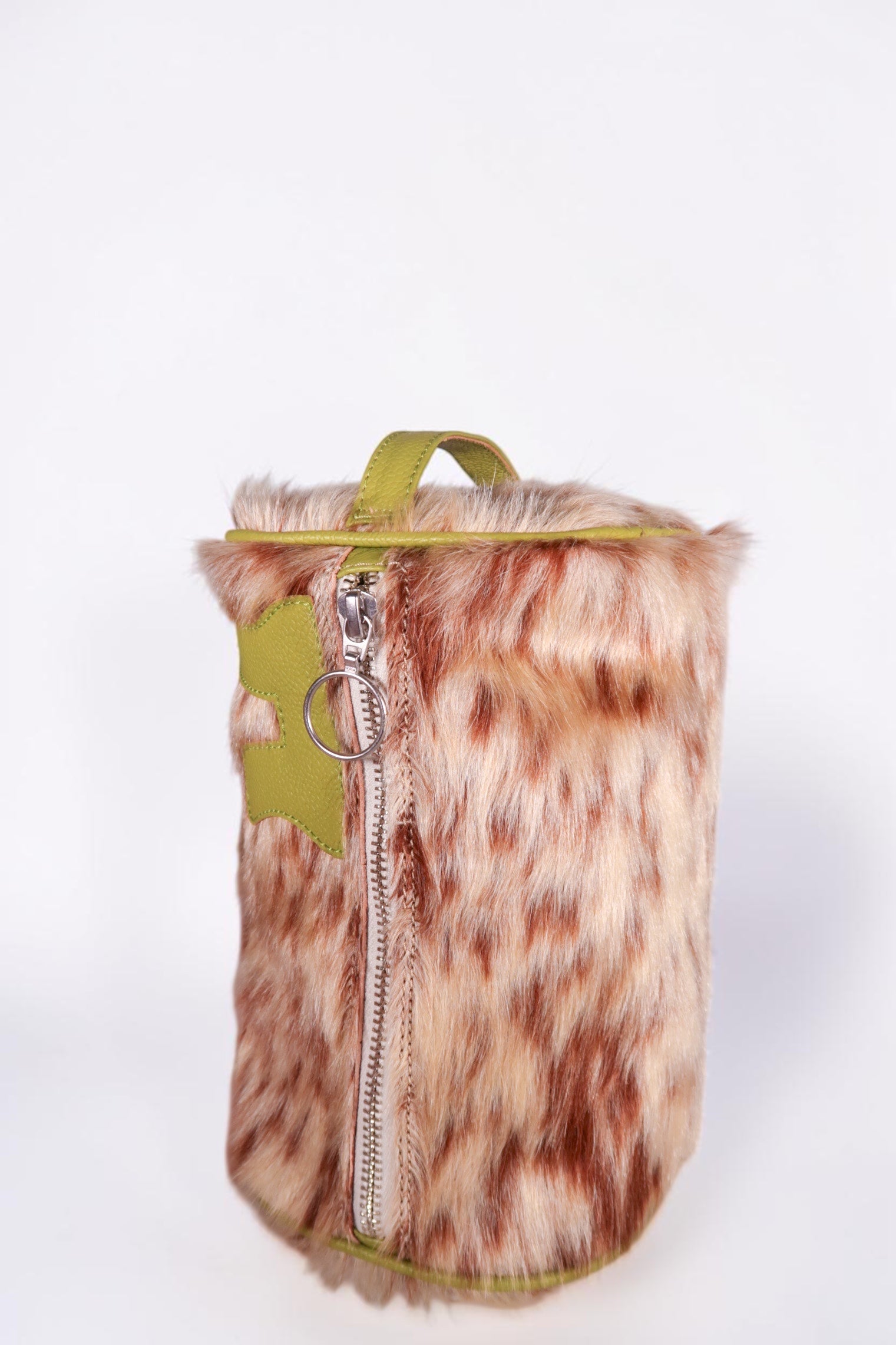 design Girls World compact cosmetic case with fur exterior in tan and brown, green leather trim, zipper, and bunny detail.