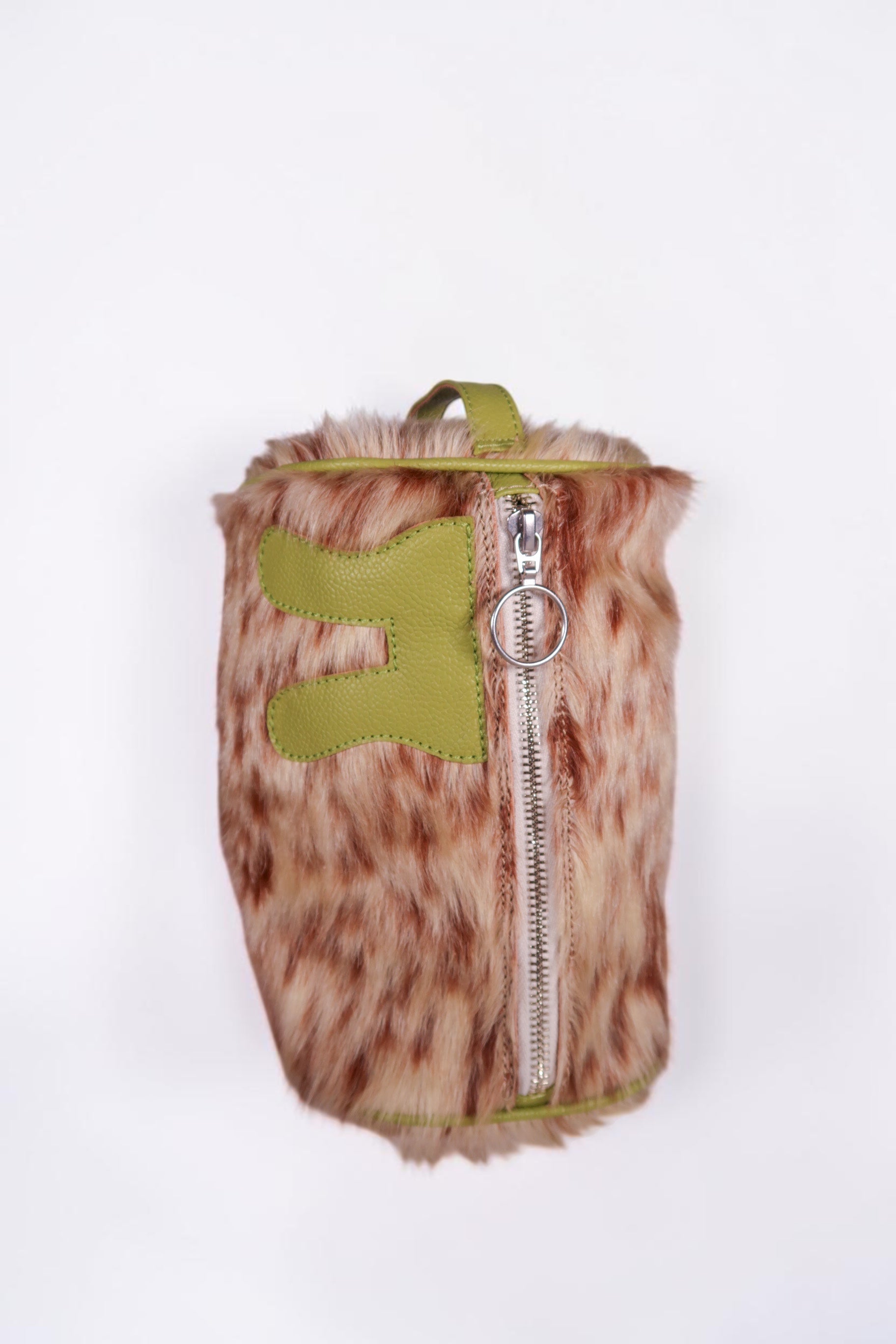 design Girls World green and brown faux fur cosmetic case with lime green leather trim and a zipper closure.